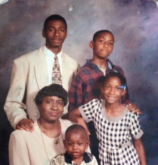 An old photo of Dr. Gerald Onuoha with his mother and siblings