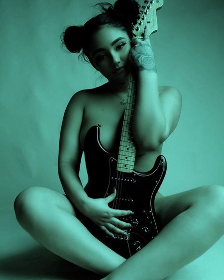 Mulan Vuitton is an American Singer