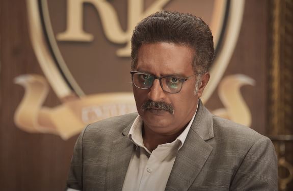 Prakash Raj as Gurudev Deshmukh, the Principal of RK University