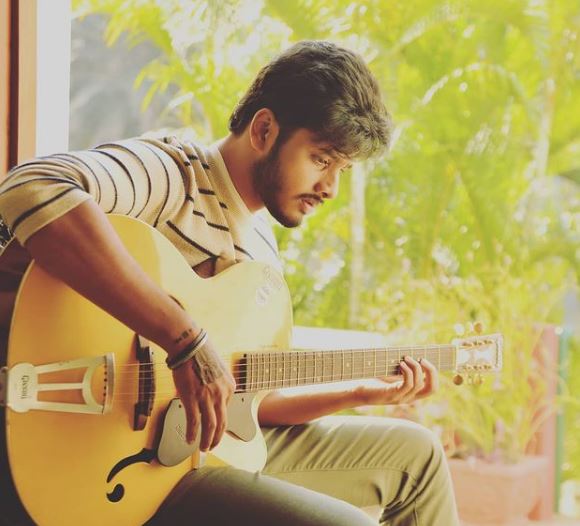 Teja Sajja loves to play guitar