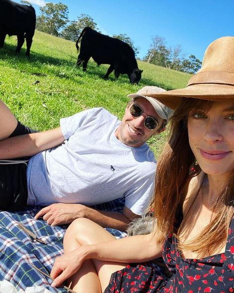 Becky Boston and Pat Cummins in a farm