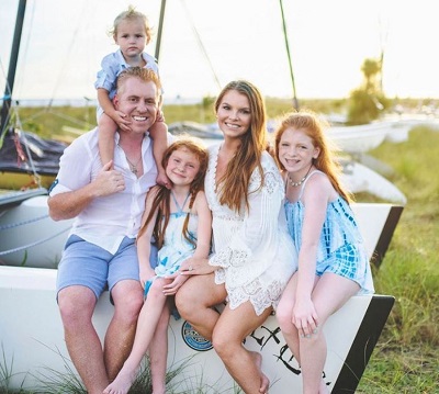 Bryan Redmond with his wife and kids