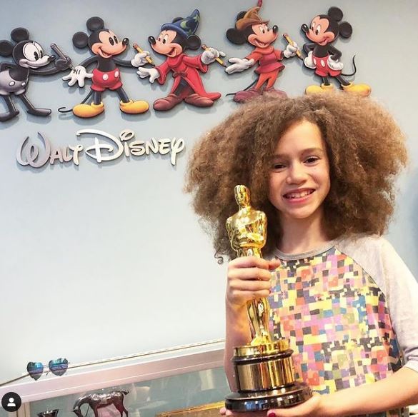Chloe Coleman hold the 1958 Oscar award