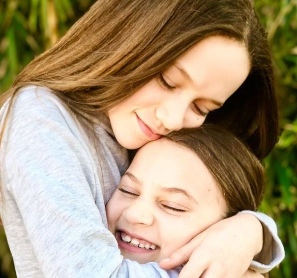 Chloe Coleman with her sister