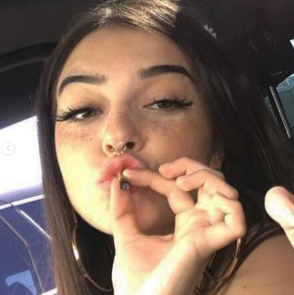 Keaton Belle smoking a cigarette