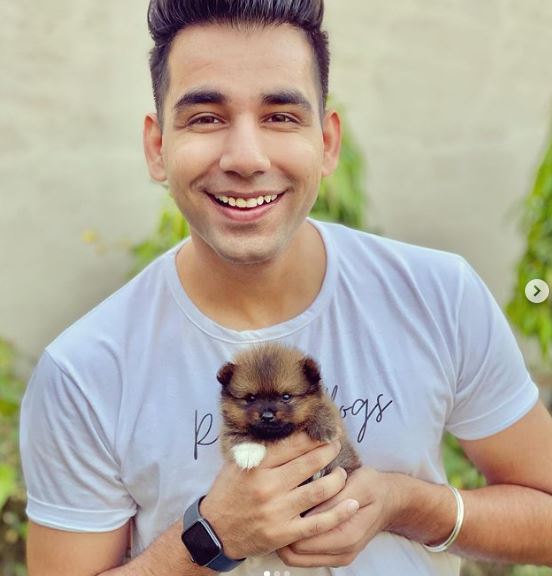 Rishi Dev with his pet dog