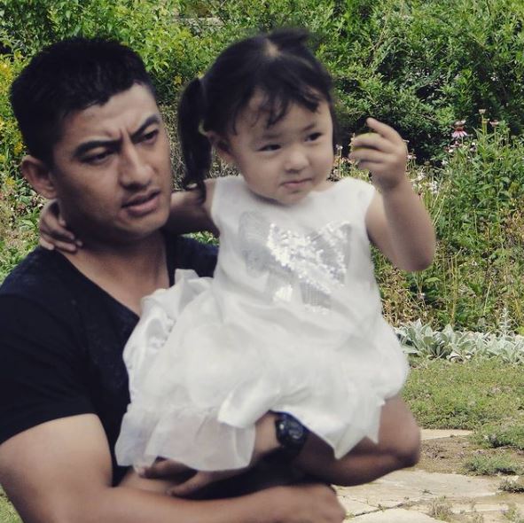 Sangay Tsheltrim with his daughter