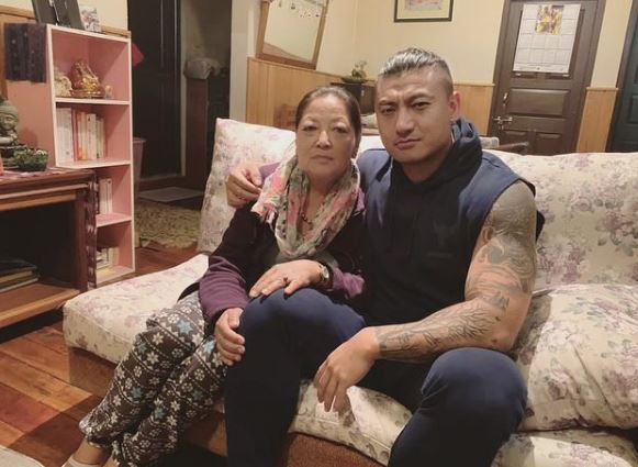 Sangay Tsheltrim with his mother