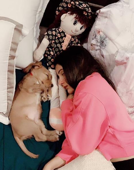 Shaylee Krishen with her pet dog and doll