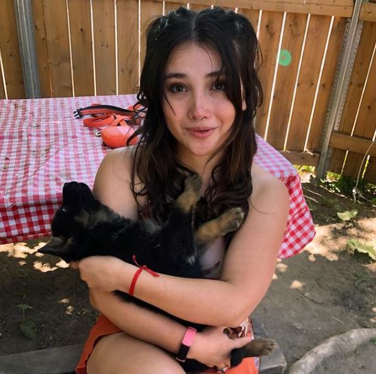 Amanda Arcuri with her pet dog Ryuk
