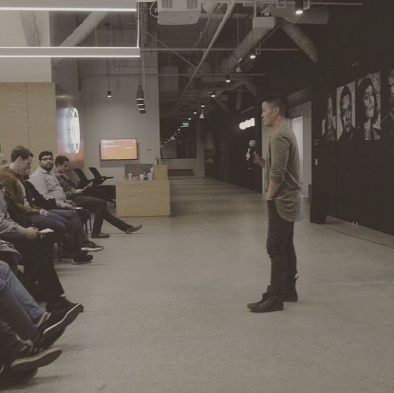 Chris Sheng giving motivational speech to students