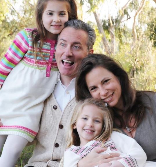 Emmy DeOliveira with her dad Joe DeOliveira, mom Debby Seligman DeOliveira, and sister Lili DeOliveira