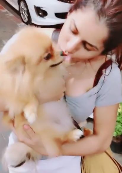 Isha Anand Sharma with a pet dog