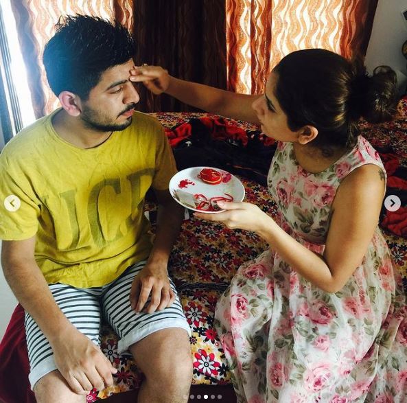 Isha Anand Sharma with her brother