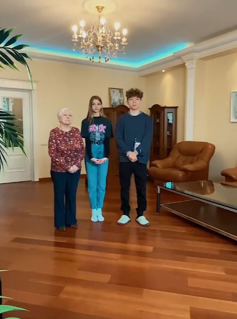 Liza Anokhina while shooting a fun video with friend Rakhim and grandmom