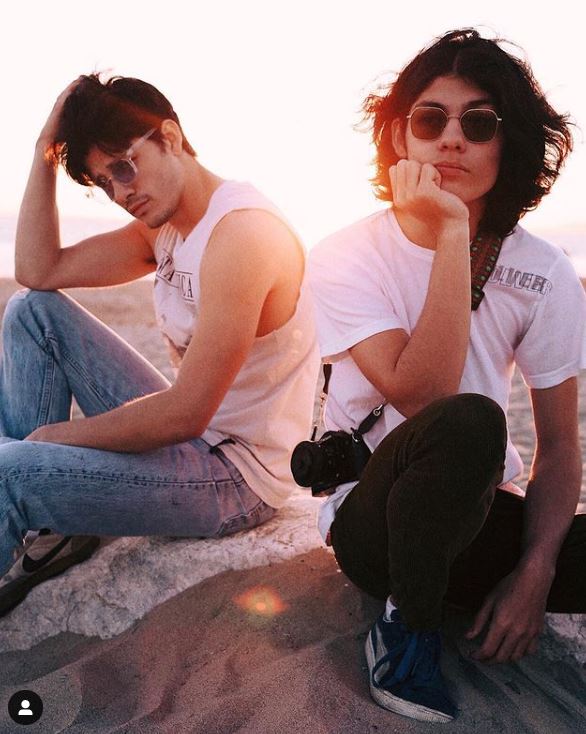 Lucius Hoyos with his brother