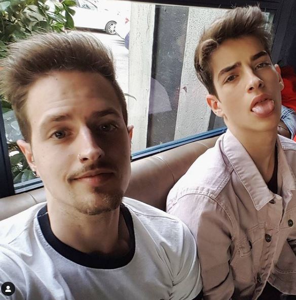 Manu Rios with his brother