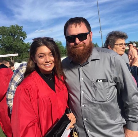 Tabitha Swatosh photographed with her father Matthew Swatosh during her graduation day