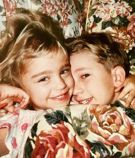 Taylor Misiak and her brother during their childhood