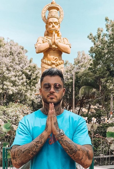 Thibault Garcia photographed with a statue of Lord Hanuman