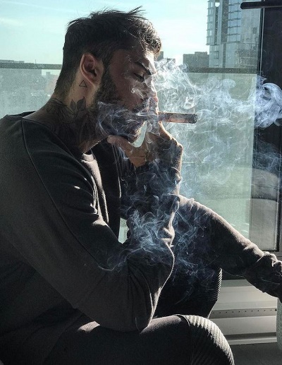 Thibault Garcia smoking a cigar