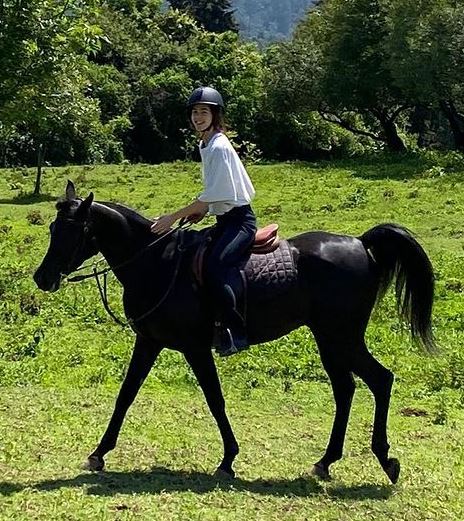 Ximena Lamadrid enjoys riding a horse