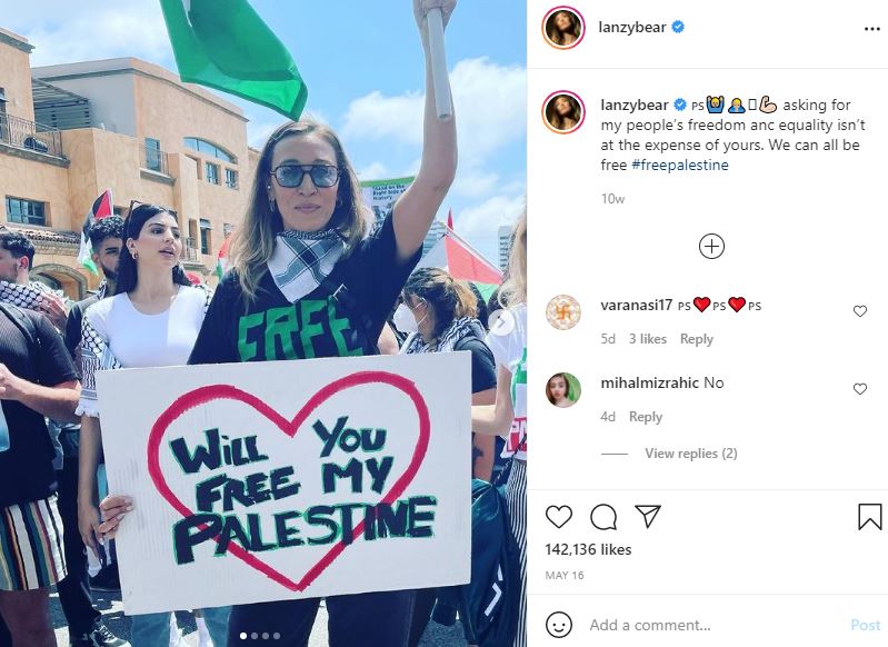 Alana Hadid stands in protests