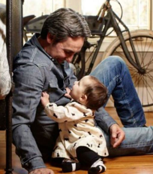 An old photo of Mike Wolfe with his daughter Charlie Faeth Wolfe