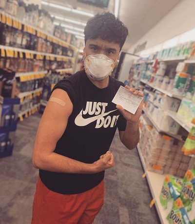 Avi Roque gets his vaccine in April 2021