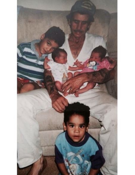 Childhood image of Keeta Vaccaro with his father and siblings