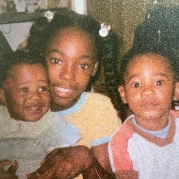 Childhood photo of Pastor Keion Henderson with his siblings