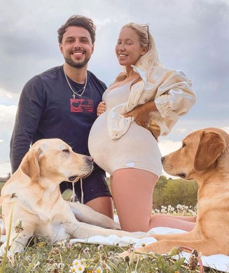 Elle Darby with her fiance Connor Swift and their pet dogs