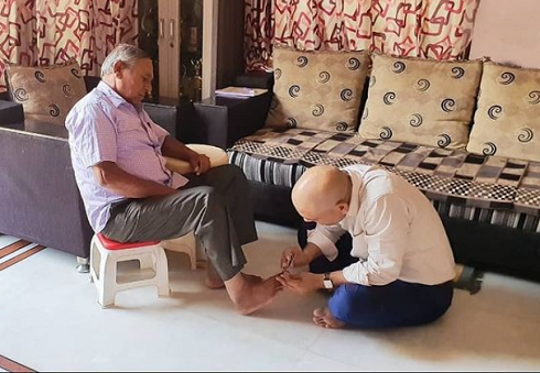 Harshvardhan Jain cutting his father's nails