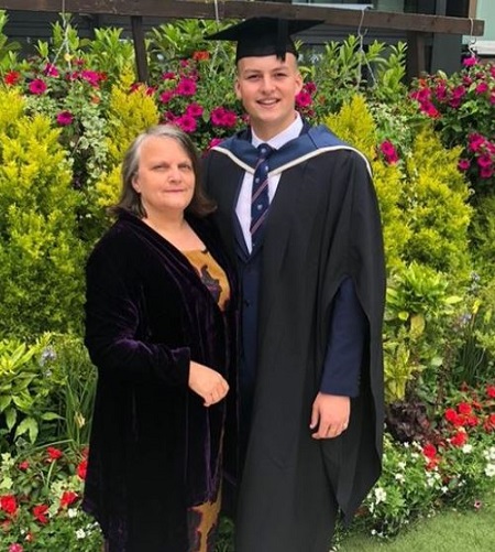 Hugo Hammond photographed with his mother on his graduation ceremony day