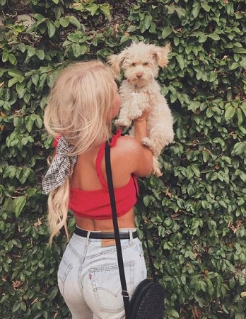 Kara Kavajecz with her pet dog Emmery Jo