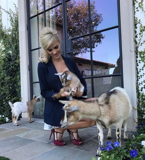 Leanna Bartlett off set spending some time with some baby goats