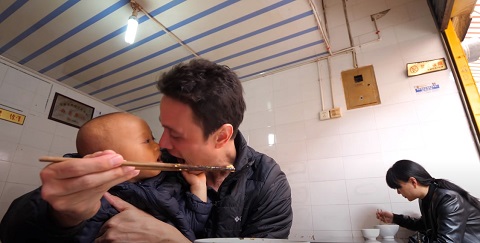 Mark Wiens enjoying Chinese Street Food with his new born son Micah Wiens