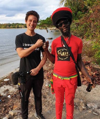 Mark Wiens in the streets of Jamaica with Rasta Mocco