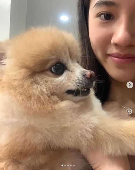 Panisara Rikulsurakan and her pet dog Tai