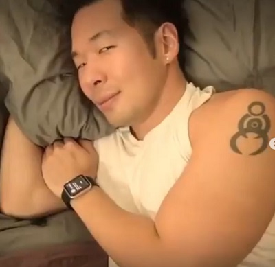 QPark showing his tattoo