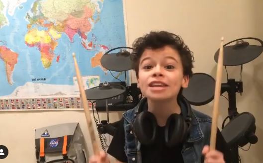 Raphael Alejandro learns to play drums