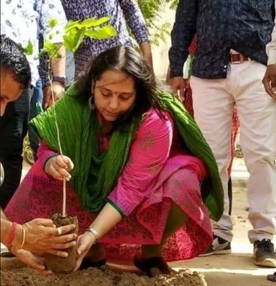 Remya Mohan while sapling plant during an event