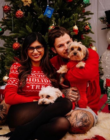 Robert Sandberg and Mia Khalifa with their pet dogs