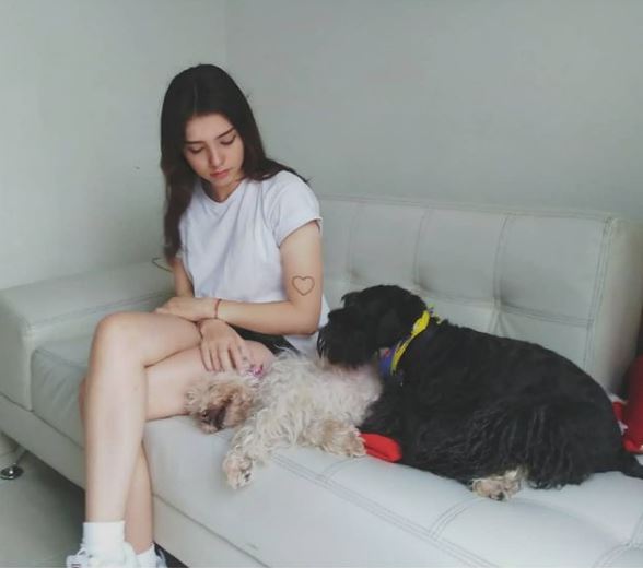 Valentina Acosta with her pet dogs