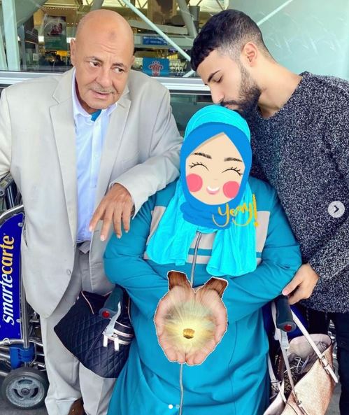 Adam Saleh with his mother and father