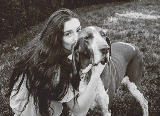Audrey Caroline with her pet dog