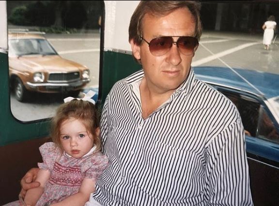 Childhood photo of Charlotte Bellis with her father