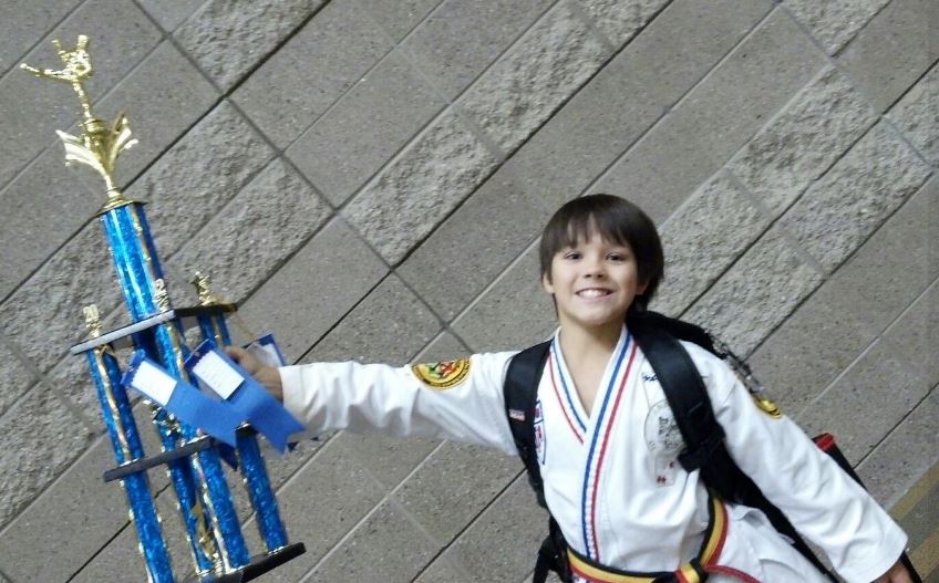 Ian Ousley won trophy in Taekwondo