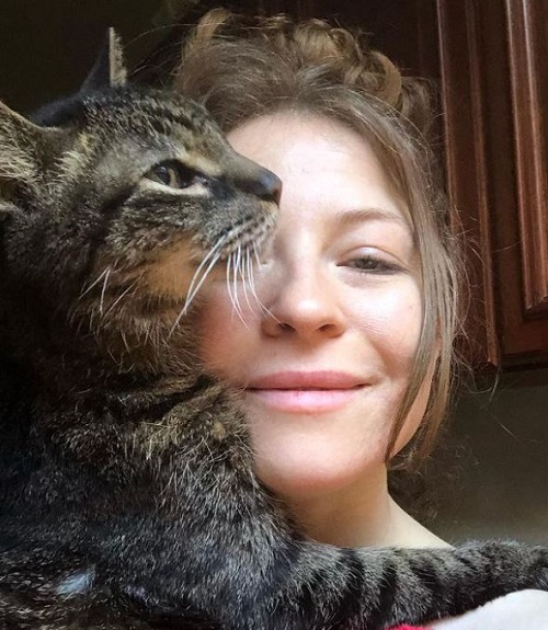 Katie Ross has a pet cat named Roman