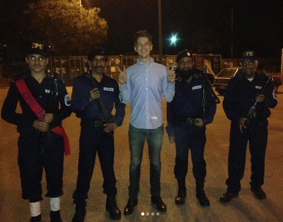 Mark with security guards in Pakistan